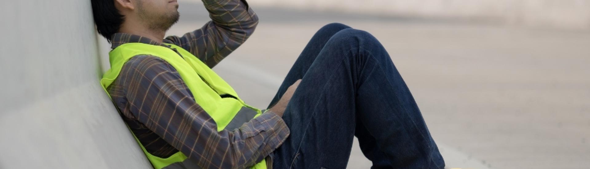 Sad stressed lone worker in hi vis