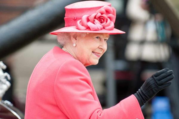 Photo of Queen Elizabeth II wearing a pink hat and coat