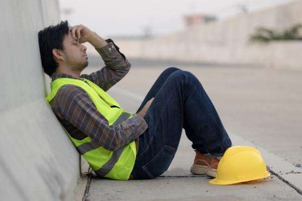 Sad stressed lone worker in hi vis